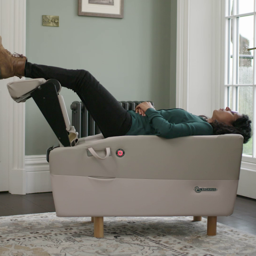 A guest receiving a BackHug robotic back therapy treatment at PURE Spa UK