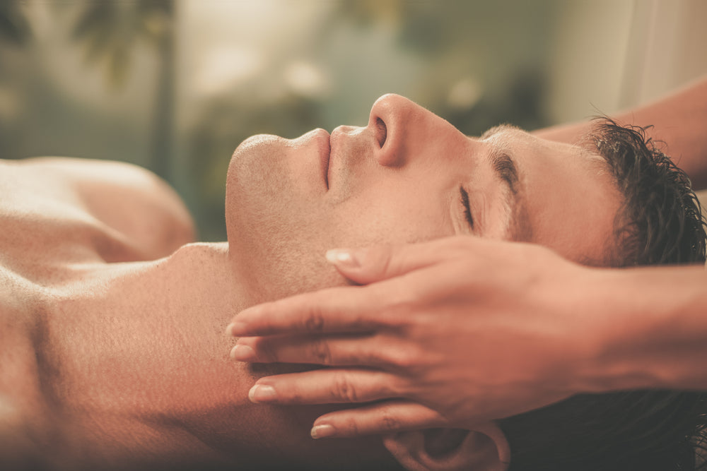 Man receiving an energising facial at PURE Spa & Beauty, the second treatment in the His Birthday package