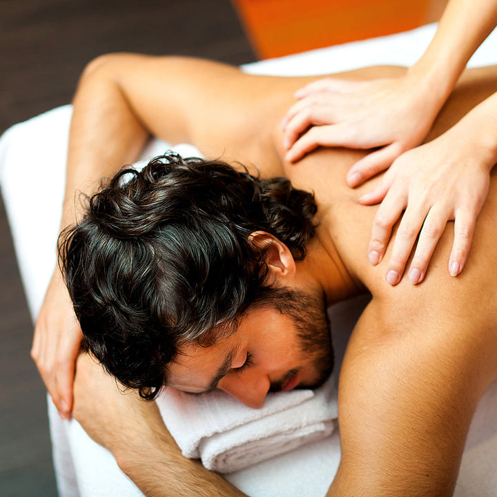 Man receiving a deep tissue back massage at PURE Spa & Beauty, part of the His Birthday gift experience